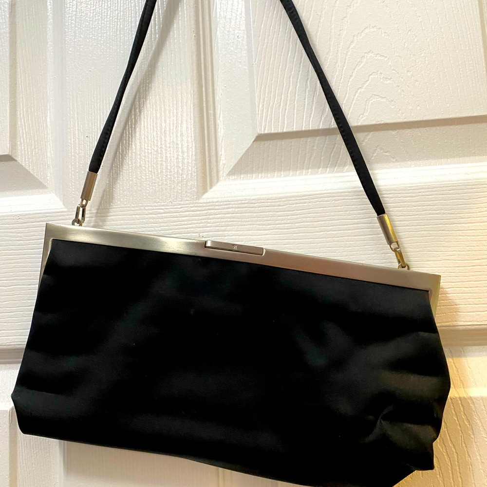 Black satin authentic Calvin Klein evening bag with small strap and silver.